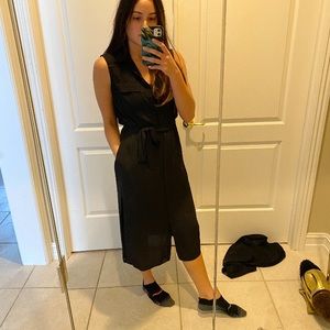 Sleeveless black shirt dress with side slits
